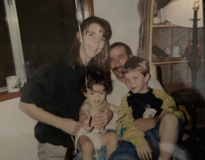 Picture of Tom with his wife and kids.
